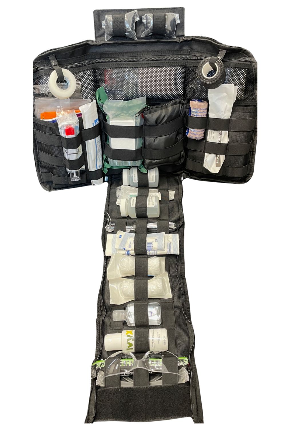 JumpMedic kit opened flat, showing labeled elastic loops and mesh compartments